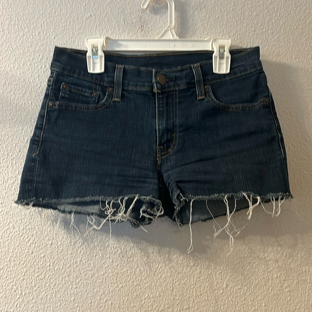 Levis dark wash raw hem jean shorts size 26